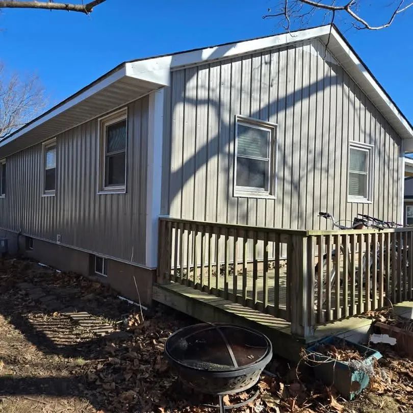 New metal siding panels installed on an exterior wall