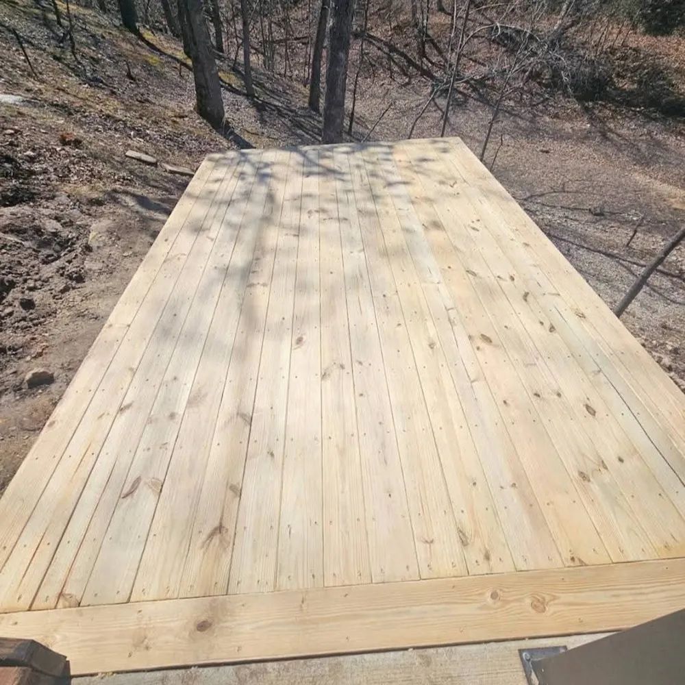 Pressure-treated deck framed to carry a hot tub